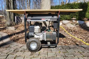 plywood and bungee cord diy rain cover for running generator