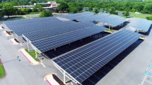 solar array with solar panels on parking lot structure roof
